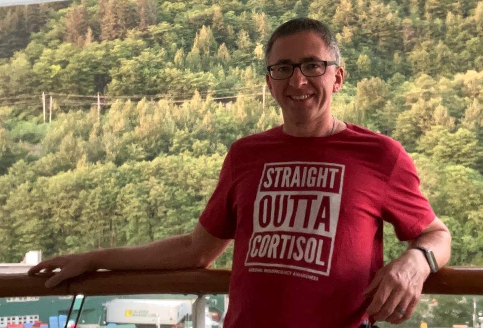 Image man wearing red Straight Outta Cortisol t-shirt